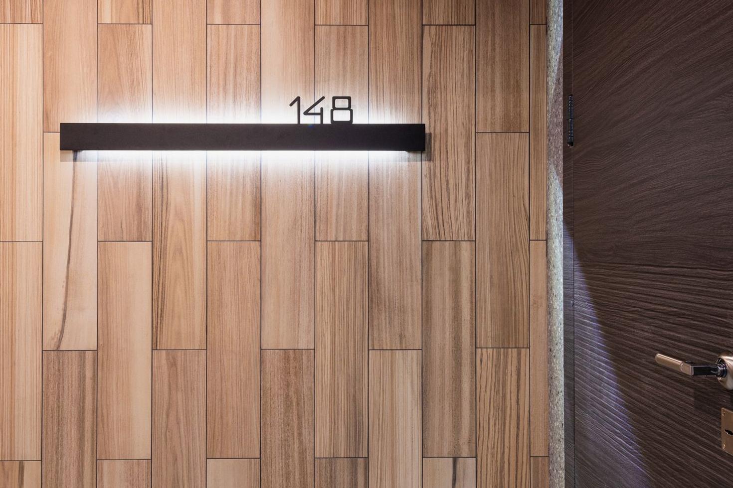 Warmly lit room threshold at Happylivo Hotel
